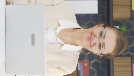 Vertical-video-of-Business-woman-smiling-at-camera.